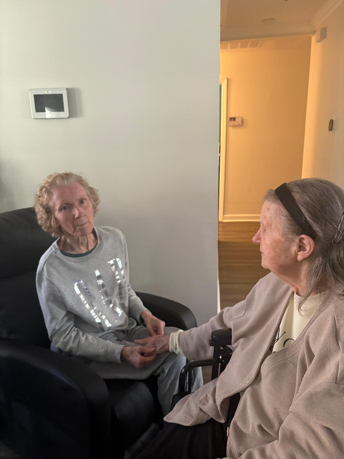 Two women residents enjoying a quiet conversation