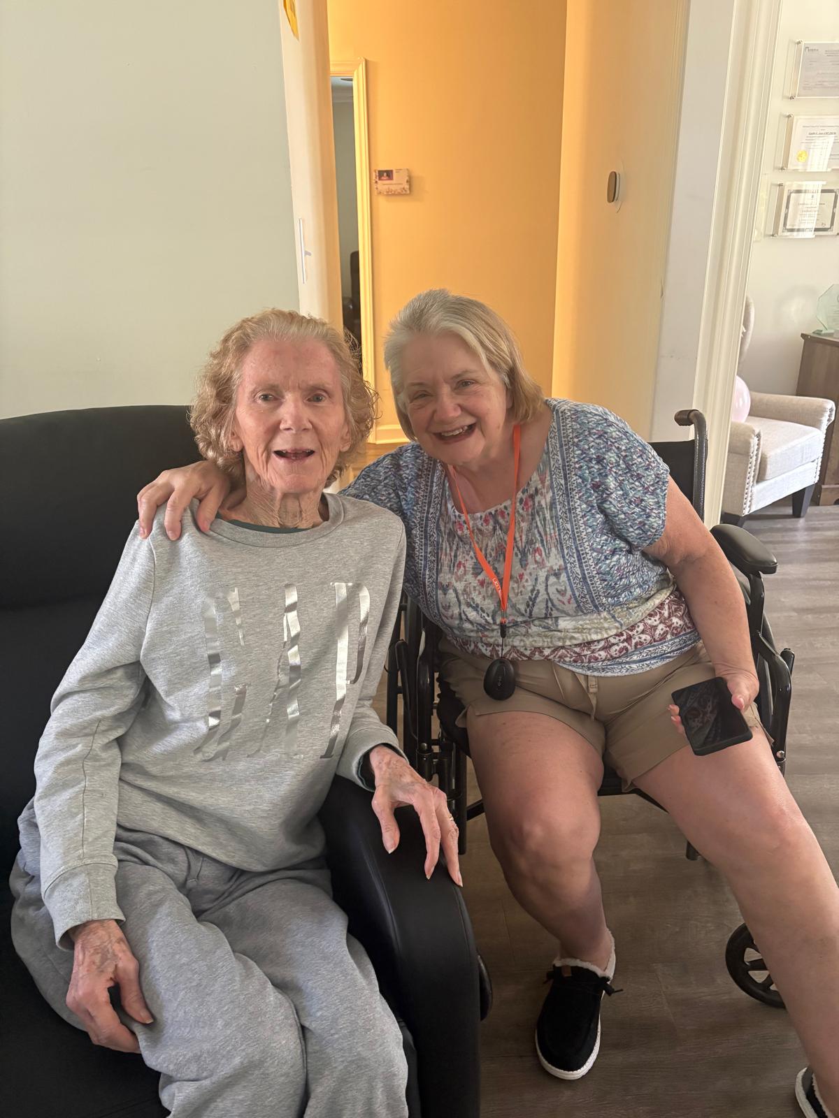 Two women residents sharing a happy moment at Gracious Senior Living