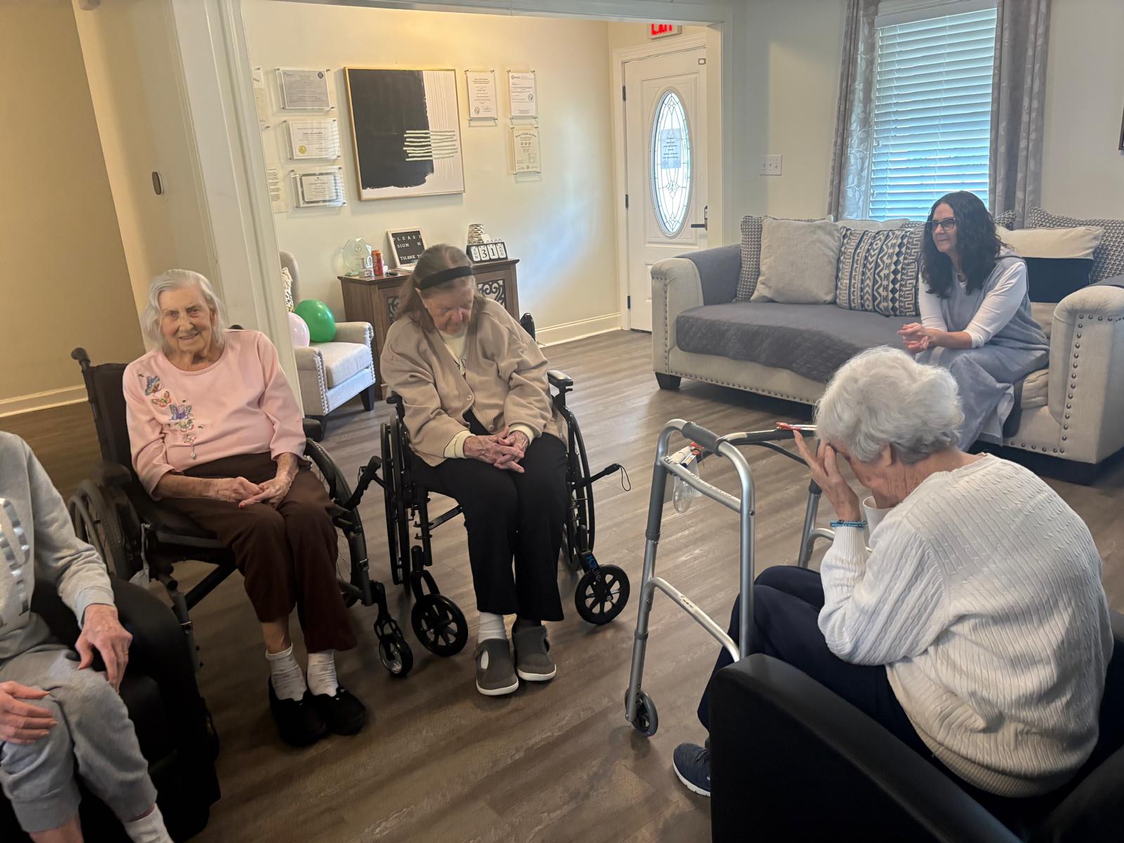 Women residents gathered in the Gracious Senior Living lounge