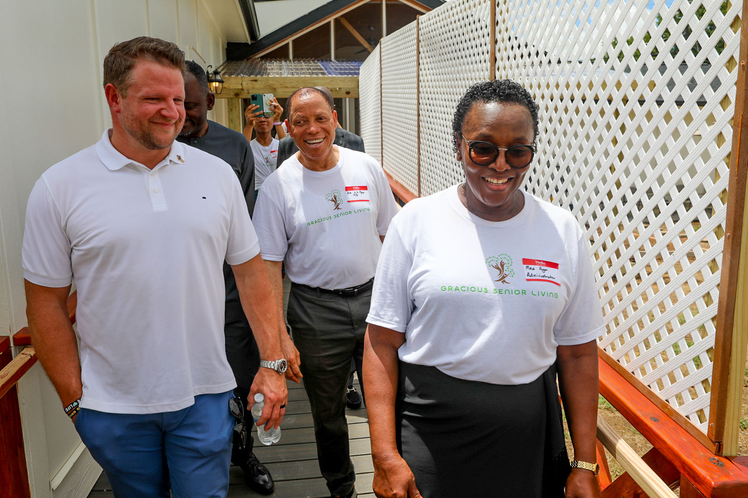 Gracious Senior Living team members and supporters walking together on opening day